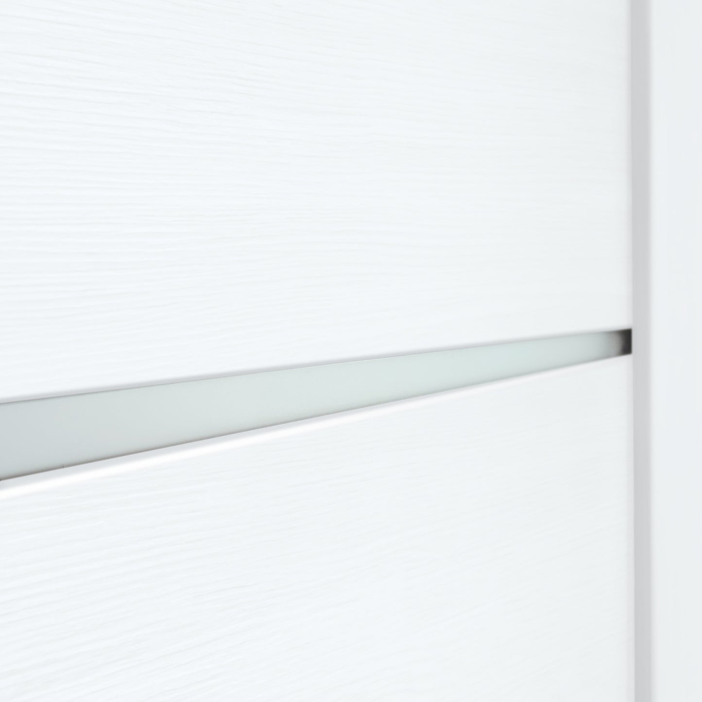 Close-up of a frosted-glass insert in Miami White door slab with white PVC wood-look finish